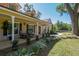 Inviting front porch with seating and potted plants, perfect for enjoying the outdoors at 40600 Louise Rd, Umatilla, FL 32784
