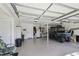 Spacious garage with high ceilings, utility vehicle, and ample storage possibilities at 40600 Louise Rd, Umatilla, FL 32784