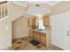 Functional kitchenette area with wooden cabinets, sink, and a convenient layout at 40600 Louise Rd, Umatilla, FL 32784