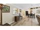 Living area featuring dining table, kitchen access, and plenty of natural light at 40600 Louise Rd, Umatilla, FL 32784