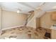 Comfortable living room area with a staircase, neutral walls, and tile flooring at 40600 Louise Rd, Umatilla, FL 32784