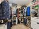 Spacious walk-in closet provides plenty of storage for clothing, shoes and accessories at 40600 Louise Rd, Umatilla, FL 32784