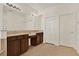 Bright bathroom with a double vanity, ample storage, and tiled flooring at 4393 S Devon Ct, Kissimmee, FL 34746