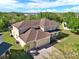 Aerial view of a two-story home with a two-car garage and lush landscaping at 4393 S Devon Ct, Kissimmee, FL 34746
