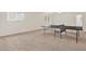 Bright and airy game room with large windows, ceiling fan, and neutral carpet flooring at 4393 S Devon Ct, Kissimmee, FL 34746