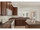Well-equipped kitchen with an island, white appliances, and breakfast bar at 4393 S Devon Ct, Kissimmee, FL 34746