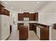 Modern kitchen with center island, stylish cabinets, and stainless steel appliances at 4393 S Devon Ct, Kissimmee, FL 34746