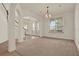 Open-concept living area with tile floors, natural light, and staircase at 4393 S Devon Ct, Kissimmee, FL 34746