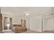Bright main bedroom with a ceiling fan, carpet, and neutral walls with an attached bathroom at 4393 S Devon Ct, Kissimmee, FL 34746