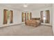 Spacious main bedroom with three large windows providing natural light and neutral decor at 4393 S Devon Ct, Kissimmee, FL 34746