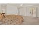 The primary bedroom has neutral carpet and overlooks a covered balcony at 4393 S Devon Ct, Kissimmee, FL 34746