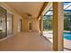 Inviting outdoor living space with pool views, ceiling fan, and sliding glass doors at 4393 S Devon Ct, Kissimmee, FL 34746
