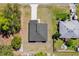 Birds-eye view showing the property's roof, surrounding yard, neighboring homes, and adjacent concrete driveway at 4761 Sw 142Nd Place Rd, Ocala, FL 34473