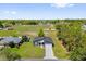 Aerial view of home with large yard next to a public park and baseball fields at 4761 Sw 142Nd Place Rd, Ocala, FL 34473