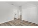 Bedroom with wood floors featuring a spacious closet and attached bathroom at 4761 Sw 142Nd Place Rd, Ocala, FL 34473