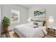 Cozy bedroom with stylish decor, a plush bed, and a window overlooking the yard at 4761 Sw 142Nd Place Rd, Ocala, FL 34473