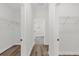 Walk-in closet with wire shelving, wood-look flooring, and neutral paint at 4761 Sw 142Nd Place Rd, Ocala, FL 34473