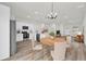 Open concept kitchen with stainless appliances, island, and view into living space at 4761 Sw 142Nd Place Rd, Ocala, FL 34473