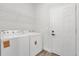 Functional laundry area with washer, dryer and shelving for optimal storage at 4761 Sw 142Nd Place Rd, Ocala, FL 34473