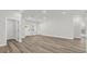 Spacious, bright living room with wood floors, featuring neutral walls and natural light at 4761 Sw 142Nd Place Rd, Ocala, FL 34473