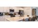 Modern kitchen featuring stainless steel appliances, white cabinets, and a large center island at 4839 Sunflower St, Lake Hamilton, FL 33851