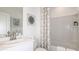 Clean bathroom with a shower-tub combination, modern fixtures, and neutral decor for a functional and stylish space at 4940 Bluebell Ct, Lake Hamilton, FL 33851