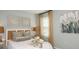 Cozy bedroom with natural light, neutral tones, and decorative accents creating a warm and inviting space at 4940 Bluebell Ct, Lake Hamilton, FL 33851