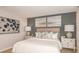 Serene bedroom featuring soft lighting, neutral decor, and a comfortable bed for a peaceful retreat at 4940 Bluebell Ct, Lake Hamilton, FL 33851