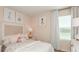 Charming bedroom featuring a cozy bed with pink accents and soft lighting, perfect for a serene retreat at 4940 Bluebell Ct, Lake Hamilton, FL 33851