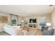 Inviting living room with modern decor, plush seating, and a large entertainment center at 4940 Bluebell Ct, Lake Hamilton, FL 33851