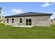 Backyard of home featuring a patio and grassy lawn at 531 Marion Oaks Blvd, Ocala, FL 34473