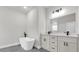 Modern bathroom featuring a freestanding tub, double vanity, and sleek fixtures at 531 Marion Oaks Blvd, Ocala, FL 34473