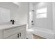 Bathroom showcasing a single vanity, black fixtures and tiled walls at 531 Marion Oaks Blvd, Ocala, FL 34473