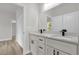Bathroom featuring double sinks, black fixtures and a quartz countertop at 531 Marion Oaks Blvd, Ocala, FL 34473