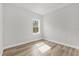 Bright bedroom with wood floors and a window with a view of the outdoors at 531 Marion Oaks Blvd, Ocala, FL 34473