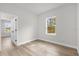 Empty bedroom featuring a window offering natural light and wood-look flooring at 531 Marion Oaks Blvd, Ocala, FL 34473