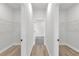 Walk-in closet featuring shelving and wood floors at 531 Marion Oaks Blvd, Ocala, FL 34473