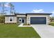 Charming single-story home featuring a well-maintained lawn and a two-car garage at 531 Marion Oaks Blvd, Ocala, FL 34473