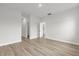 Hallway featuring wood floors and multiple doorways at 531 Marion Oaks Blvd, Ocala, FL 34473