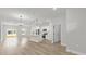 Open-concept living space featuring dining area, kitchen, and sliding glass doors to backyard at 531 Marion Oaks Blvd, Ocala, FL 34473