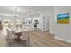 Open-concept living space featuring dining area, kitchen, and sliding glass doors to backyard at 531 Marion Oaks Blvd, Ocala, FL 34473