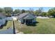 Back aerial view of home showcasing the backyard and screened in porch at 605 Swallow Ct, Apopka, FL 32712