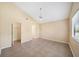 Spacious bedroom featuring tile flooring, a ceiling fan, and a large closet for storage at 605 Swallow Ct, Apopka, FL 32712