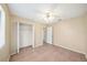 Comfortable bedroom with tile floors, a ceiling fan, and a closet for storage at 605 Swallow Ct, Apopka, FL 32712
