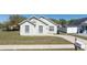 Charming home exterior with well-maintained lawn, driveway, and mailbox at 605 Swallow Ct, Apopka, FL 32712