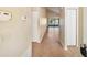 Hallway with tile floors leading to sliding glass doors, offering a view of the outdoors at 605 Swallow Ct, Apopka, FL 32712
