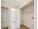 Practical laundry area with shelving and tile flooring, adjacent to the bathroom at 605 Swallow Ct, Apopka, FL 32712