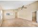 Inviting living room with high ceilings, tile flooring, and abundant natural light at 605 Swallow Ct, Apopka, FL 32712
