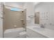 Bright bathroom with a shower and tub, white countertops, and modern fixtures at 6239 Woodhaven Village Dr, Port Orange, FL 32128