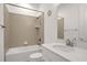 Bright bathroom with a shower and tub, white countertops, and modern fixtures at 6239 Woodhaven Village Dr, Port Orange, FL 32128